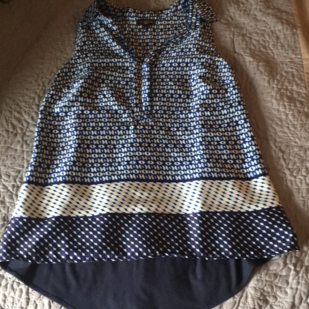 Sleeveless blue and white blouse